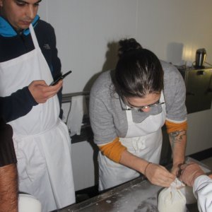 a man cutting food on a table