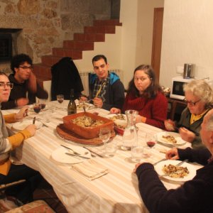 a group of people sitting at a dinner table
