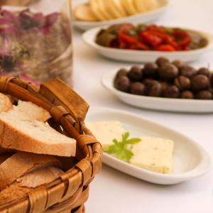 table with bread, butter and olives