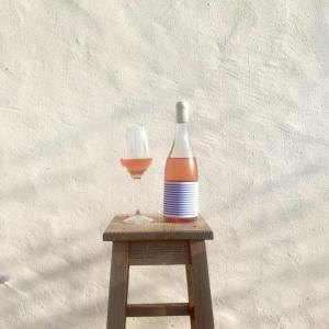 glass and bottle of rosé wine