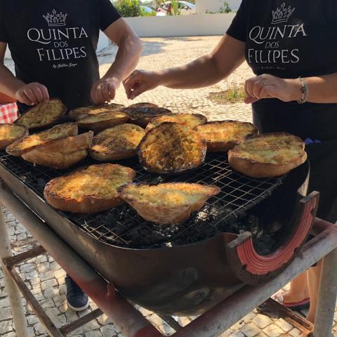 toasting bread in wine tour in lisbon