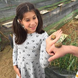 Girl enjoying a snail experience