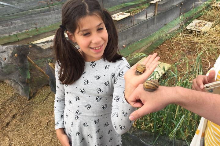 Girl enjoying a snail experience