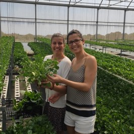 a woman standing in a garden