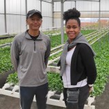 a couple of people that are standing in the street