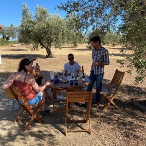 a group of people sitting on a bench in a park