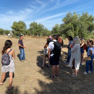 a group of people standing in a field