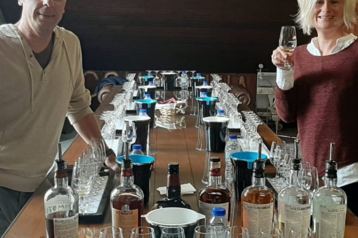 a group of people sitting at a table with wine glasses