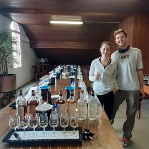 a group of people standing around a table with wine glasses