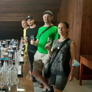 a group of people standing around a table