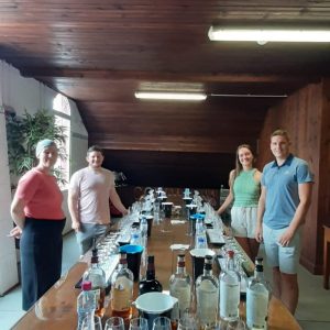 a group of people standing around a table