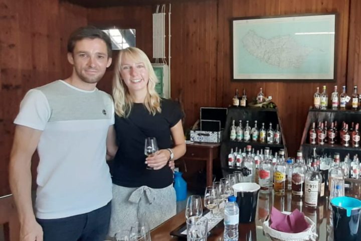 Hugh Jackman et al. sitting at a table with wine glasses