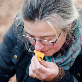 a woman eating a hot dog