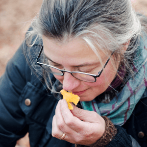 a woman eating a hot dog
