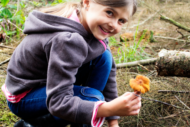a little boy that is eating some food