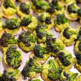 Bite-sized broccoli and spread on small crackers.