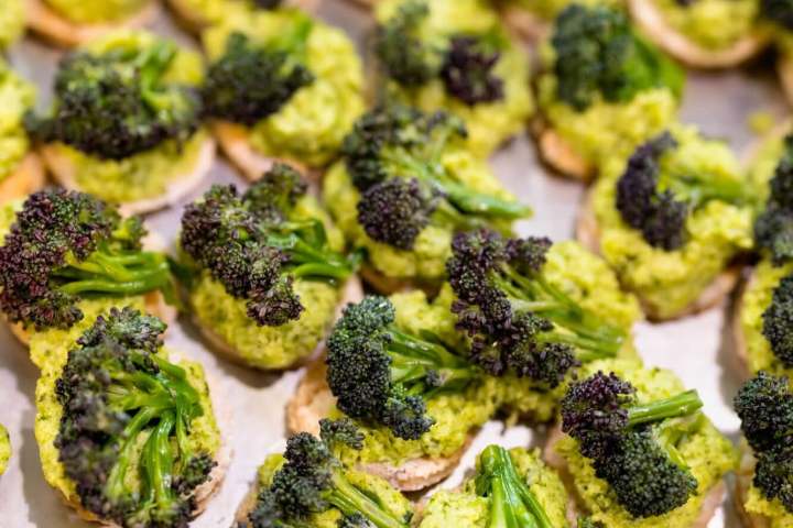 Bite-sized broccoli and spread on small crackers.