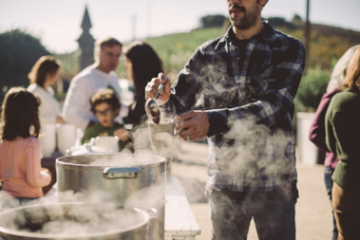 a group of people standing around each other