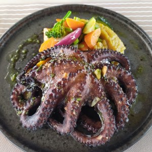 a plate of food with meat and vegetables