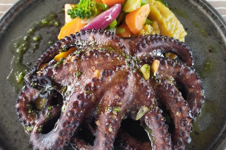 a plate of food with meat and vegetables