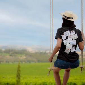 a person standing on top of a grass covered field