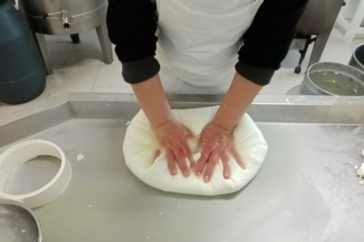 a person standing next to a sink
