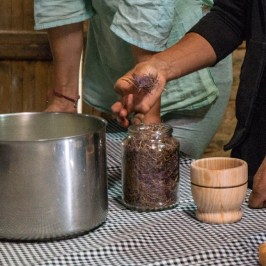 a man preparing food in a pot
