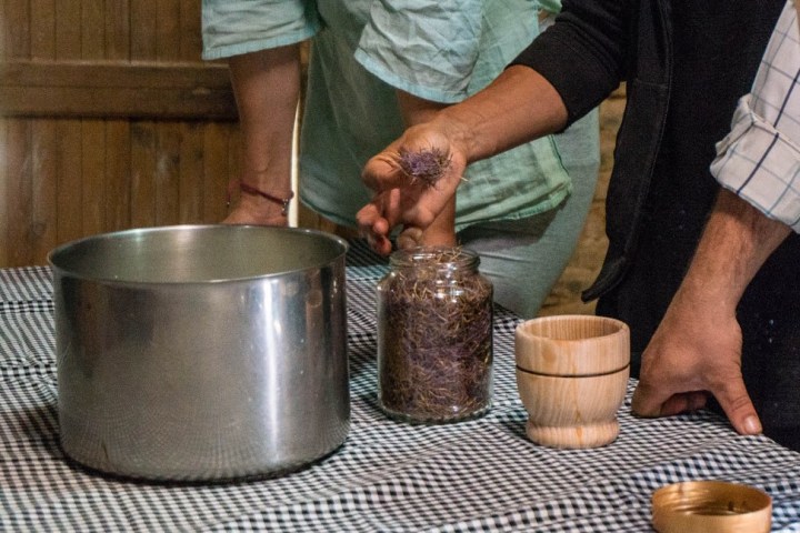 a man preparing food in a pot