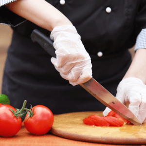 a person cutting a piece of food