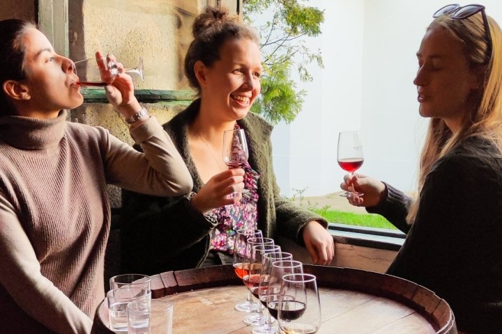 a person standing in front of a cake