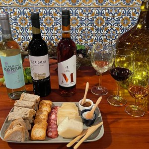 a bottle of wine sitting on top of a wooden table