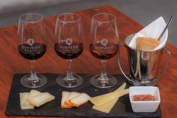 a table topped with glasses of wine