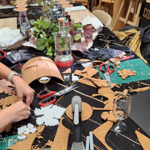 Visitor painting with red wine in a Douro Valley workshop