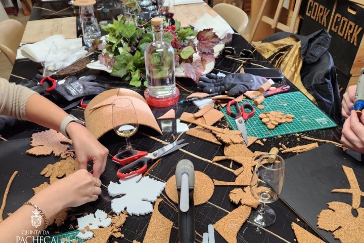 Visitor painting with red wine in a Douro Valley workshop