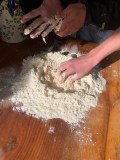 participants shaping rustic sourdough bread in Portugal