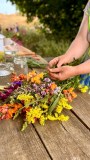 Participants learning how to make a bouquet with fresh farm flowers