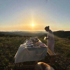 Couple enjoying a private sunset picnic in Monchique mountains overlooking the Atlantic