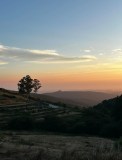 Deckchairs and private picnic setup on a Monchique hillside at sunset