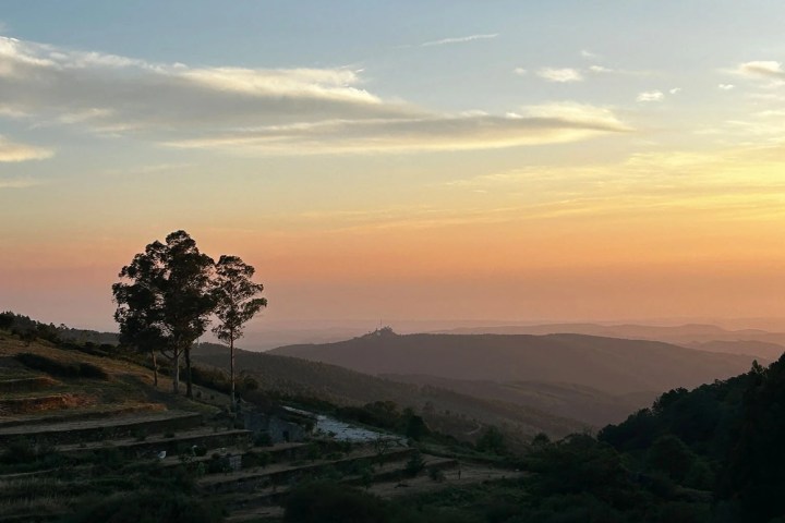 Deckchairs and private picnic setup on a Monchique hillside at sunset