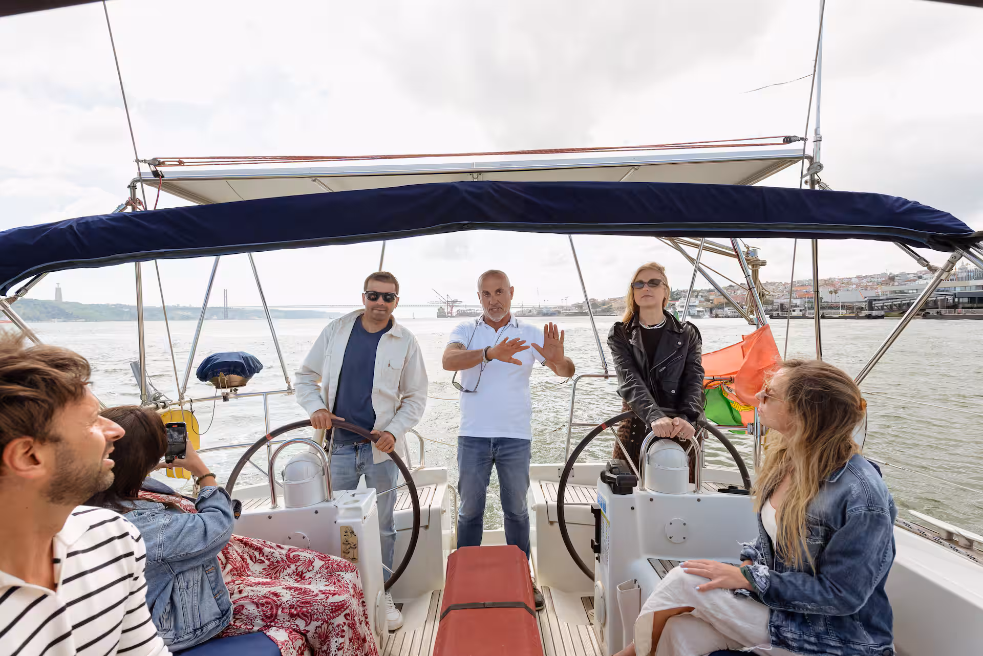 Private 47-foot sailboat sailing past Torre de Belém during a wine tasting tour in Lisbon