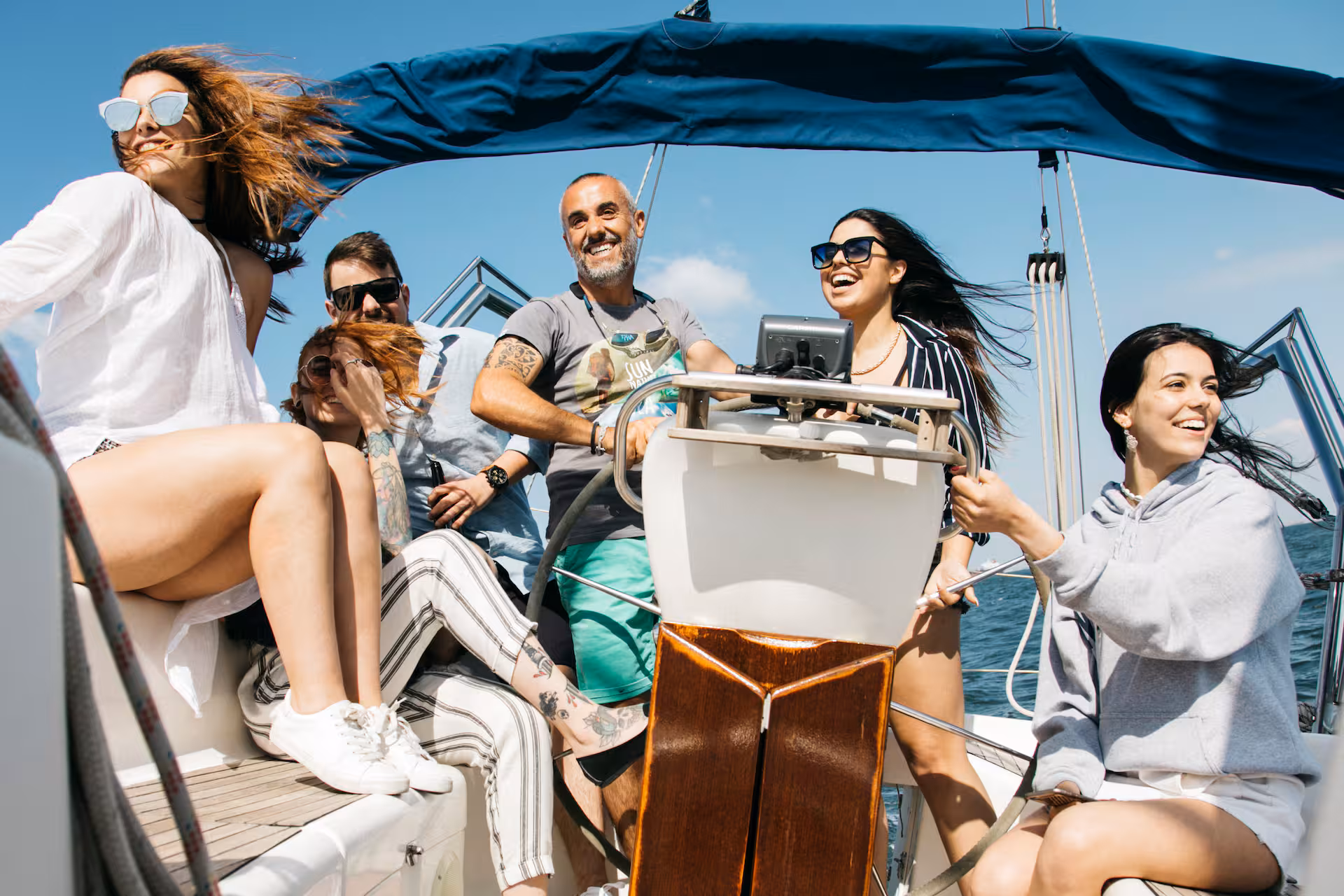 Private 47-foot sailboat sailing past Torre de Belém during a wine tasting tour in Lisbon