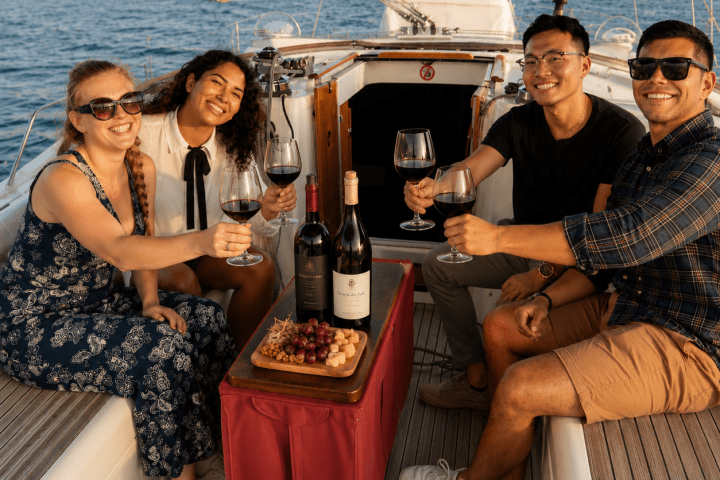 Private 47-foot sailboat sailing past Torre de Belém during a wine tasting tour in Lisbon