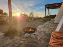 Outdoor fire pit at sunset in the Algarve countryside, Castro Marim