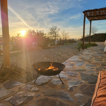 Outdoor fire pit at sunset in the Algarve countryside, Castro Marim