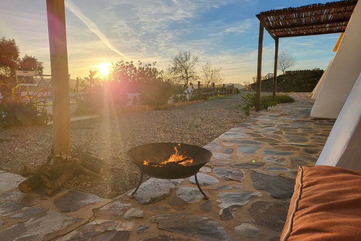 Outdoor fire pit at sunset in the Algarve countryside, Castro Marim
