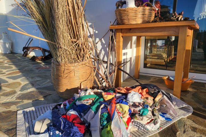 Wool yarn and weaving tools laid out for a workshop in the Algarve
